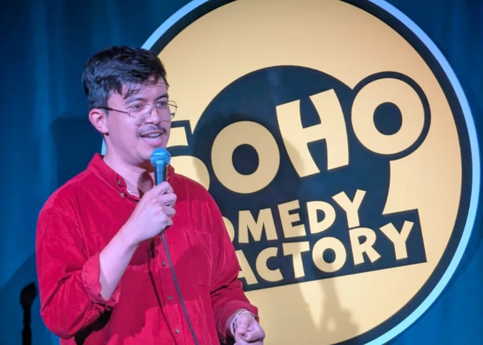 A comedian performing at Soho Comedy Factory's Coach House venue